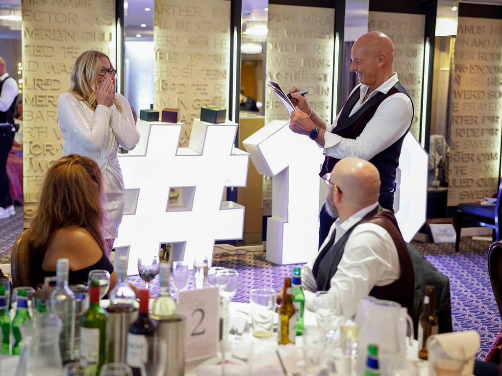 Roberto Forzoni performing close-up magic at a London office Christmas party
